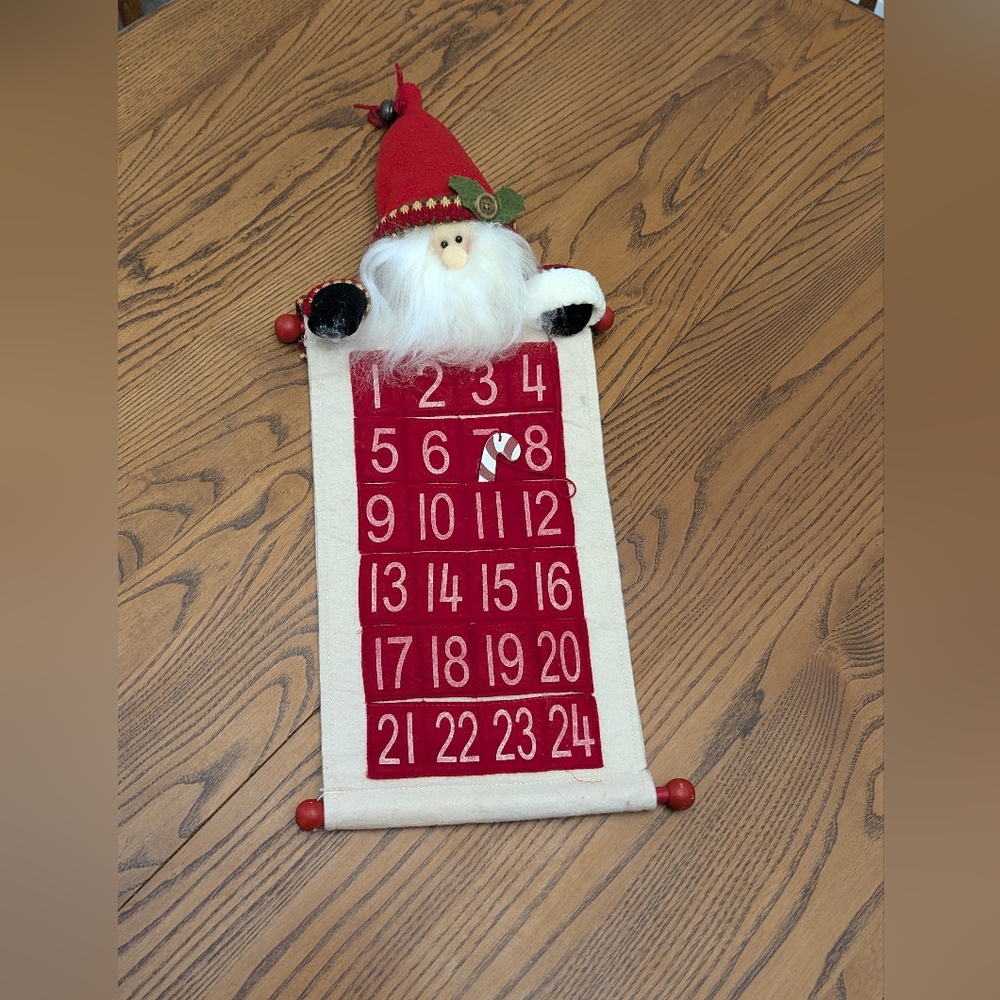 Christmas Advent Calendar. Santa With A Wooden Candy Cane To Track  The Days.